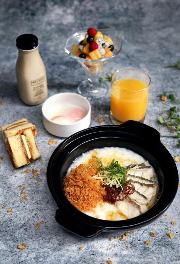 Oasia Resort Sentosa By Far East Hospitality 싱가포르 외부 사진 A bowl of congee with preserved meat and egg